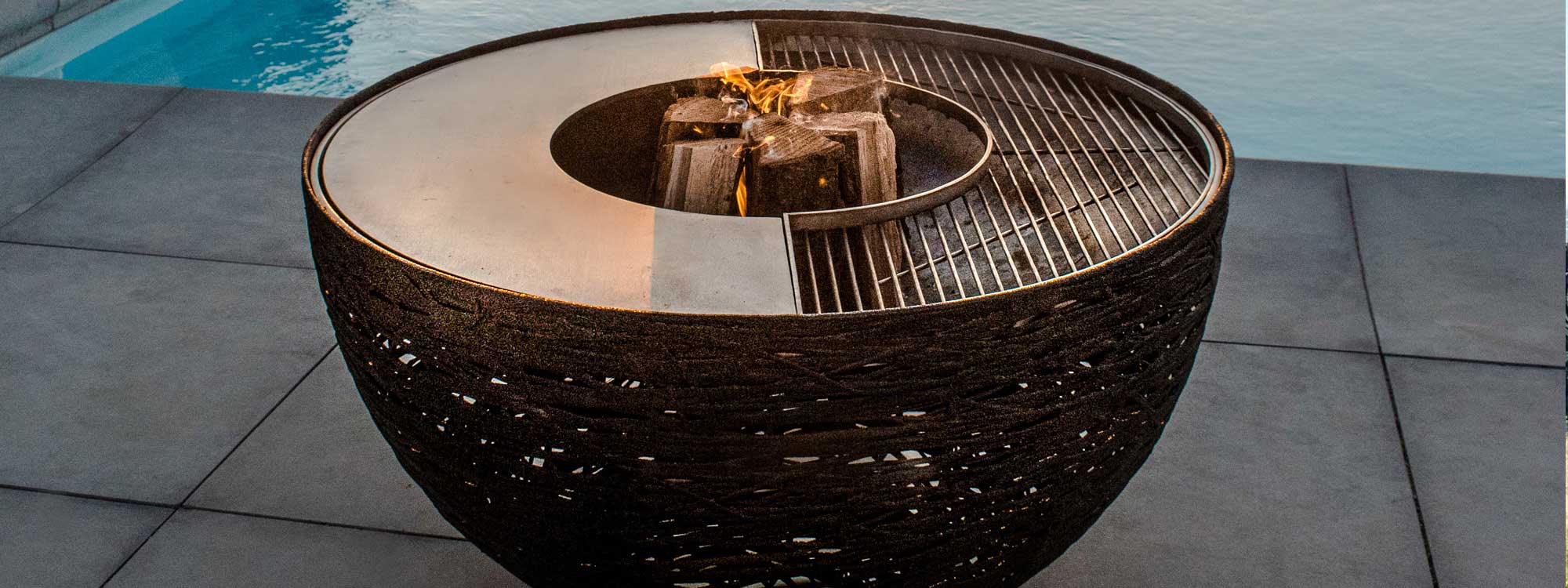 Lava Nest fire pit & modern BBQ is a chic garden fire basket in luxury fire bowl materials by Unknown Nordic basalt garden furniture company.
