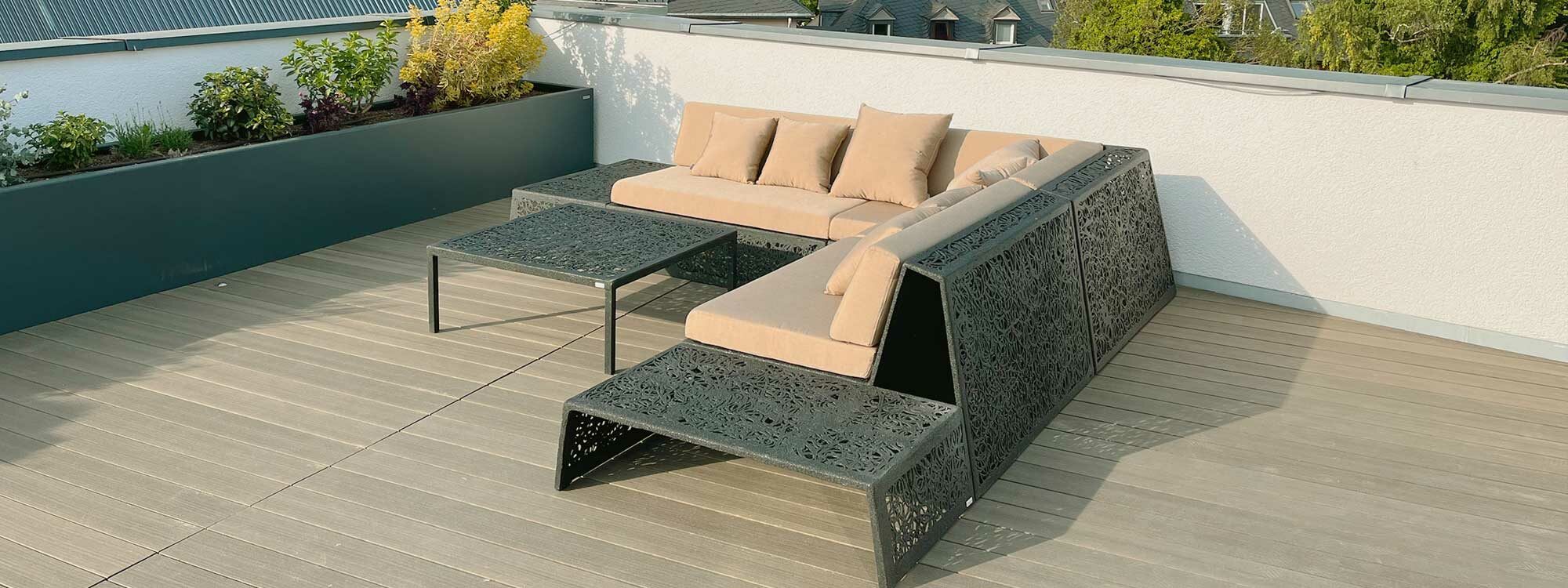 Image of Unknown Furniture's Bios black outdoor corner sofa in basalt fibre & epoxy resin