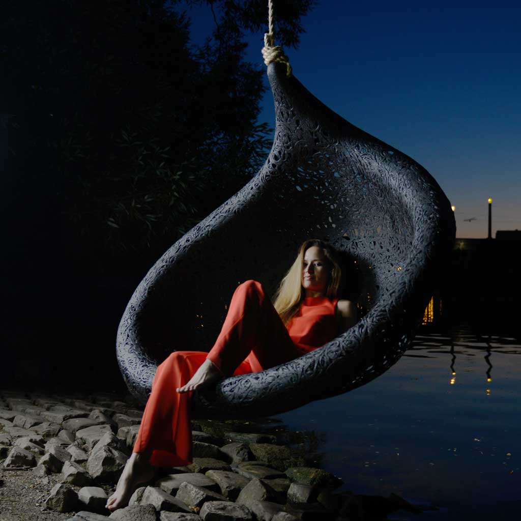 Image of woman reclining in Bios Lucid swing seat