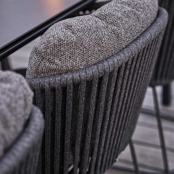 Image of detail of dark grey Soft Rope back and snug back cushion of Moments garden chair by Cane-line