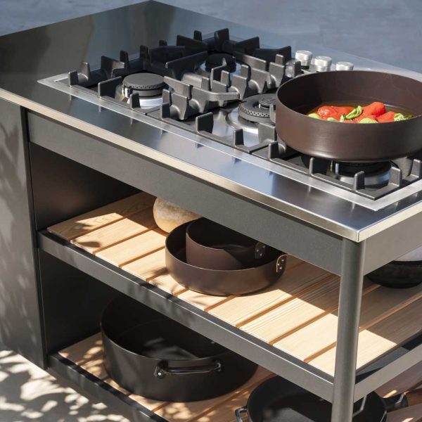 Image of RODA Norma minimalist gas bbq with pots and pans on hob and larch storage shelves
