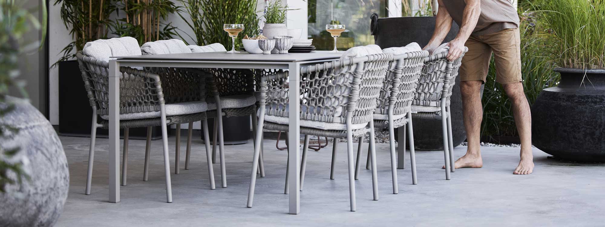 Image of Ocean woven dining chairs and Pure rectangular garden table by Caneline