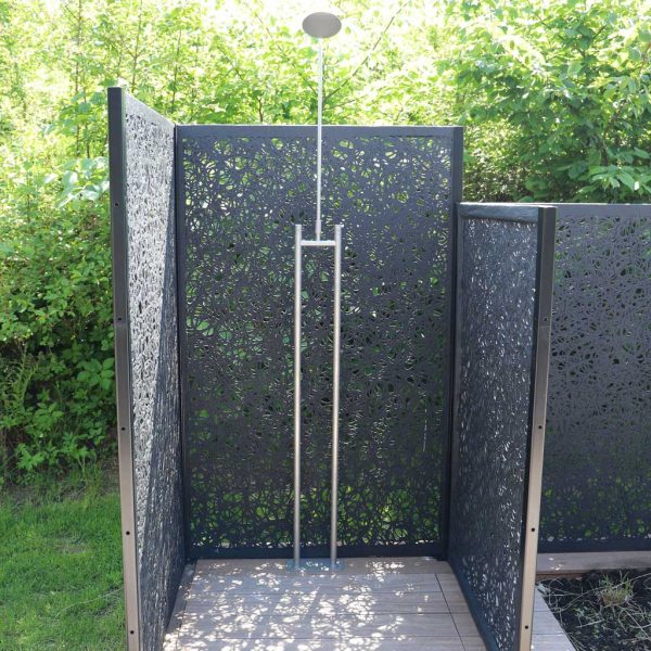 Image of garden shower on decking enclosed with black Lava panels by Unknown Furniture, creating privacy for the user.
