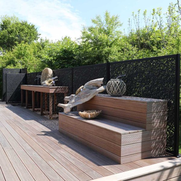 Image of black garden fence panels on wooden decked terrace by Unknown Furniture