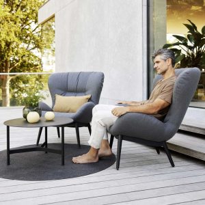 Serene outdoor wing chair is a comfy upholstered garden lounge chair with retro Scandi design by Cane-line luxury garden furniture, Denmark.
