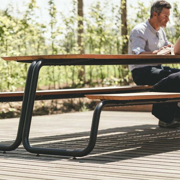 Image of The Table minimalist picnic furniture with dark-grey tubular steel frame and afzelia hardwood surfaces by Wünder garden furniture, Belgium