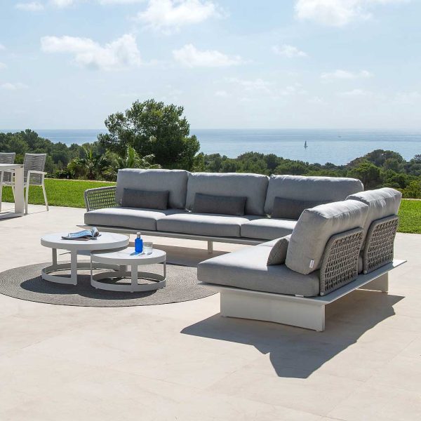 Image of Arbon contemporary garden corner sofa in white aluminium and light-grey melange woven Polyolefin rope backs on sunny poolside