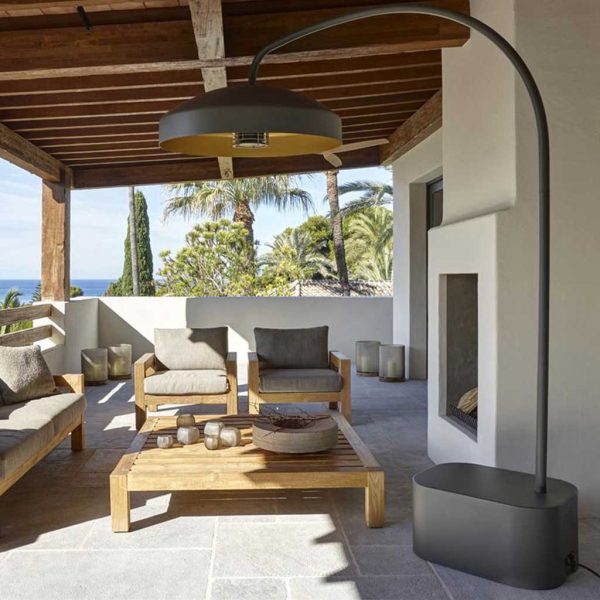 Image of pebble-colored Disc patio heater above Piet Boon teak sofa by Heatsail