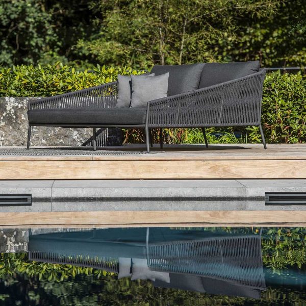 Image of Fortuna Rope contemporary outdoor daybed on decking, with reflection shown in water below