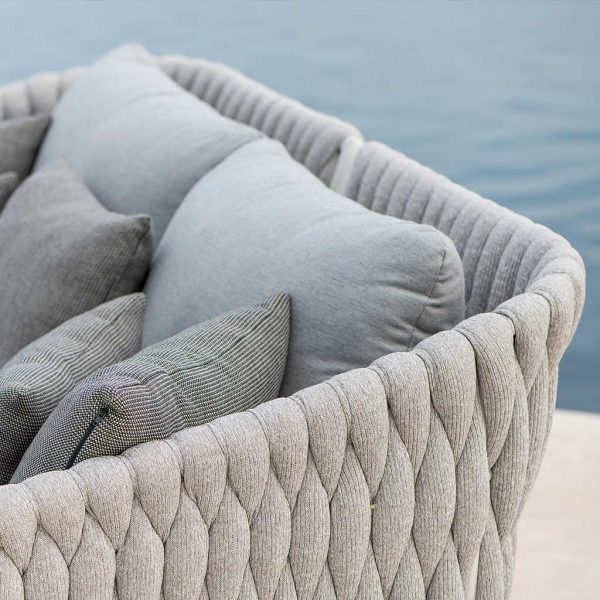 Image of detail of hand-woven Polyolefin sock back of Fortuna Socks garden daybed with Natte Grey Chine Sunbrella cushions