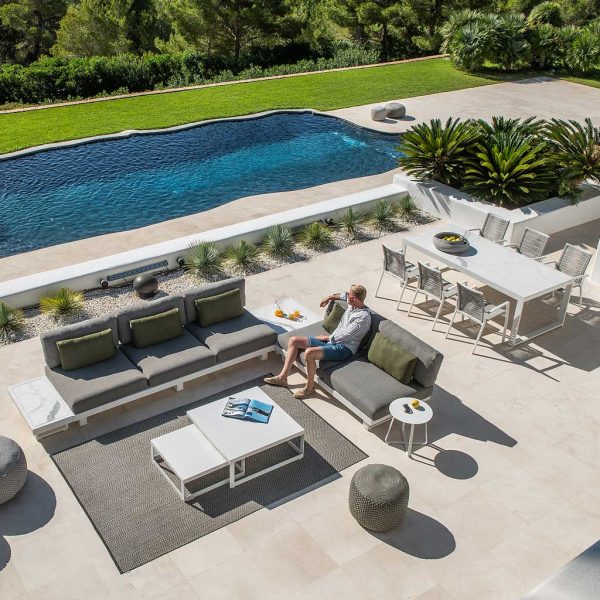 Image of aerial view of Fano aluminium corner sofa on poolside with exotic plants and lawn in the background