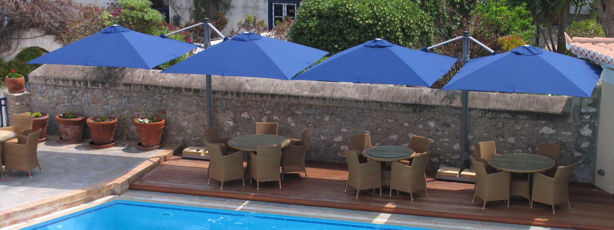 Image of 2 P6 twin canopy parasols with blue fabric and grey powder coated aluminium masts by Prostor