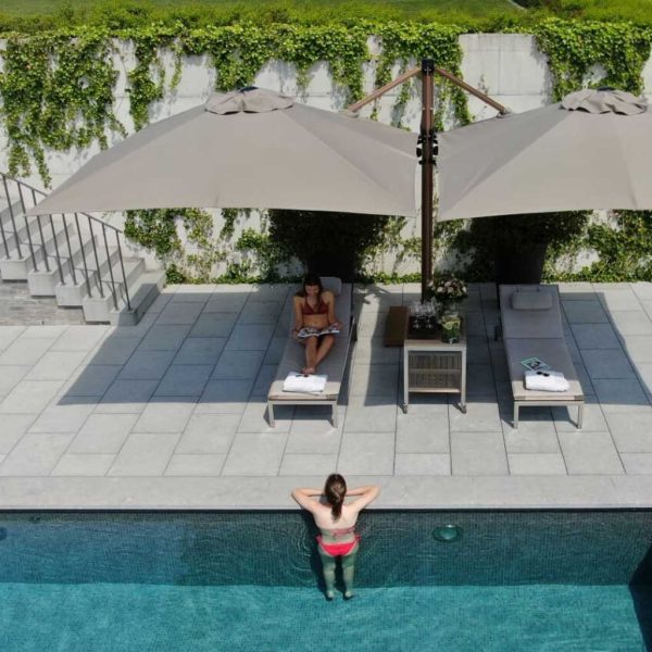Image of Prostor P6 dual canopy cantilever parasol on sunny poolside