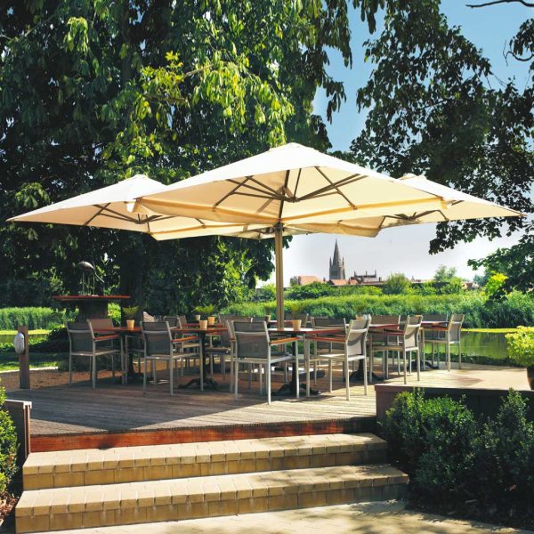 Image of Prostor P6 cantilever parasol with 4 canopies and dining furniture beneath