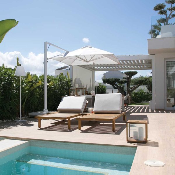 Image of Prostor P7 white cantilever parasol on sunny poolside in modern back garden
