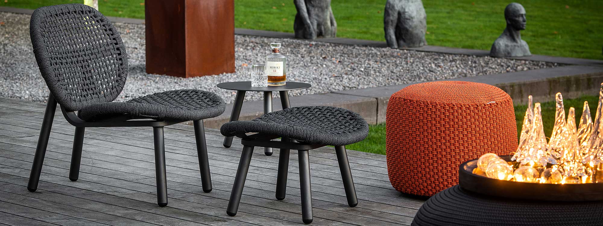 Image of Skate outdoor lounge chair and foot stool in charcoal colored tubular aluminium and charcoal coloured Polyolefin rope by Jati & Kebon