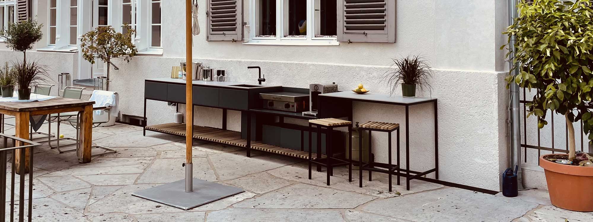 Ticino Frame outdoor kitchen & modular BBQ furniture in luxury garden kitchen materials by Conmoto minimalist garden furniture, Germany.