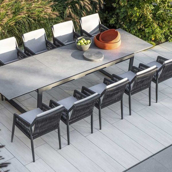 Image of aerial view of black Vigo XL extendable outdoor table with cement grey ceramic top and 10 Ritz aluminium dining chairs by Jati & Kebon