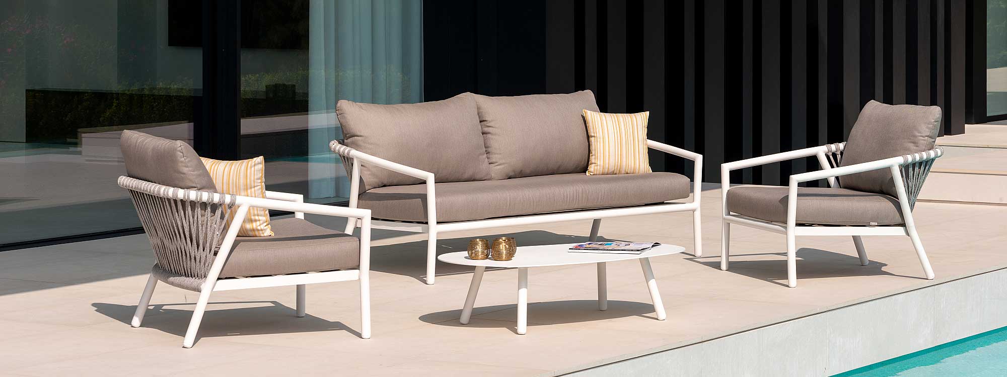 Image of Jati & Kebon Kapra 2 seat garden sofa and outdoor lounge chairs with white tubular frames and Grey Melange rope on sunlit terrace