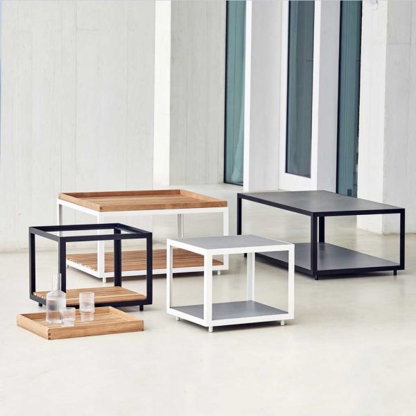 Image of range of different sizes and colors of Cane-line Level garden low tables and side tables