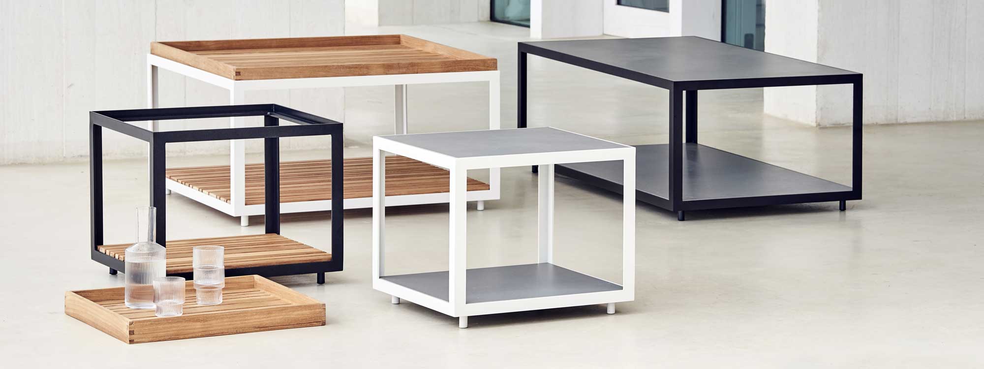 Image showing different sizes and finishes of Cane-line Level low tables and coffee tables