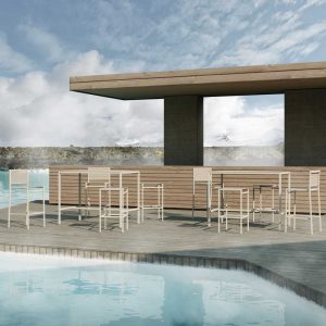 Image of 45 modern outdoor bar stools with and without backs, together with 45 exterior bar table, shown on chilly poolside with snowy mountains in the background