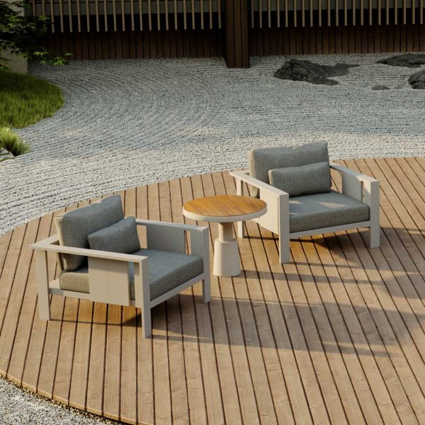 Image of pair of Oiside Beam modern garden lounge chairs and Drums geometric side table, shown on circular wooden decking surrounded by carefully raked hōkime gravel garden