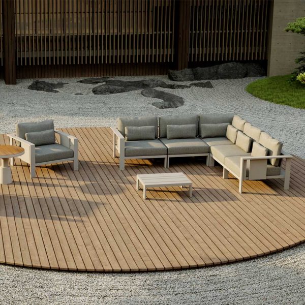 Image of aerial view of Beam contemporary garden sofa by Oiside, shown on circular wooden decking surrounded by carefully raked patterned gravel