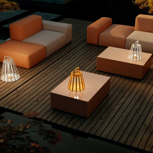 Image of OiCandles orange and white garden lanterns around Elements modern garden sofa by Oiside, Spain