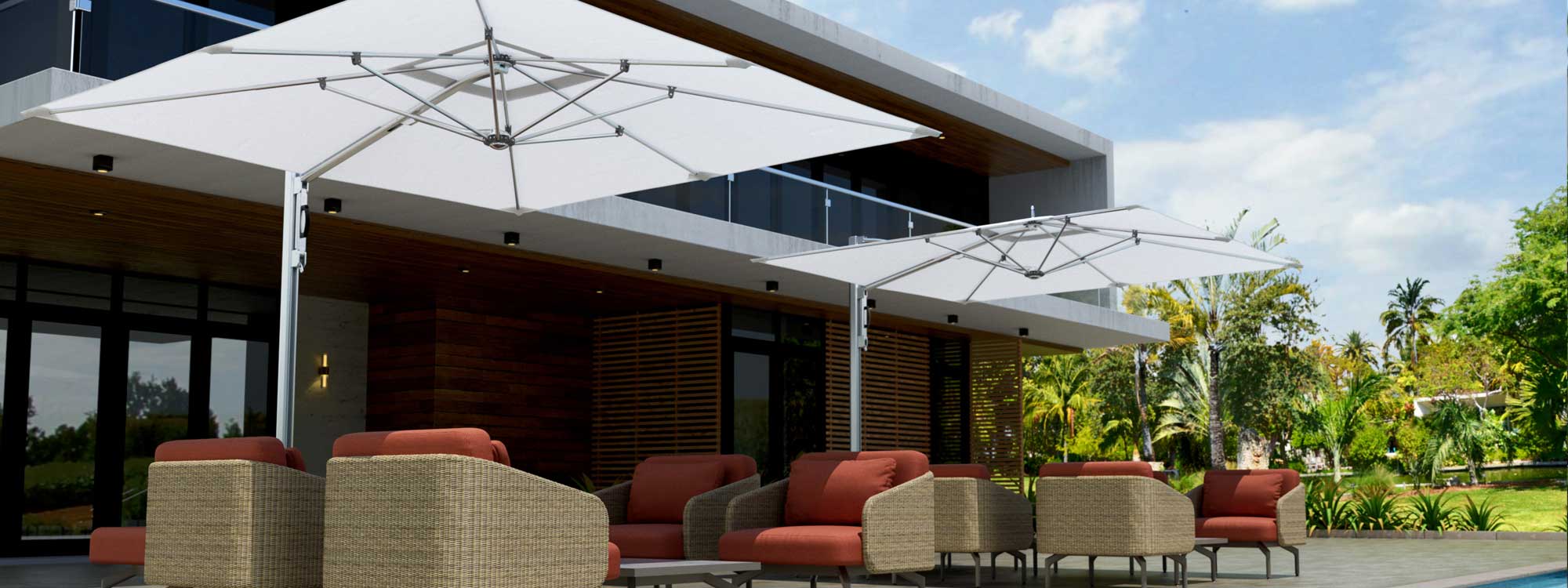 Image of white Tuuci Ocean Master cantilever parasols on hotel terrace above modern lounge furniture