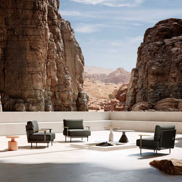 Image of Oiside Penda lounge chairs on hot and sunny terrace, with arid canyon in the background
