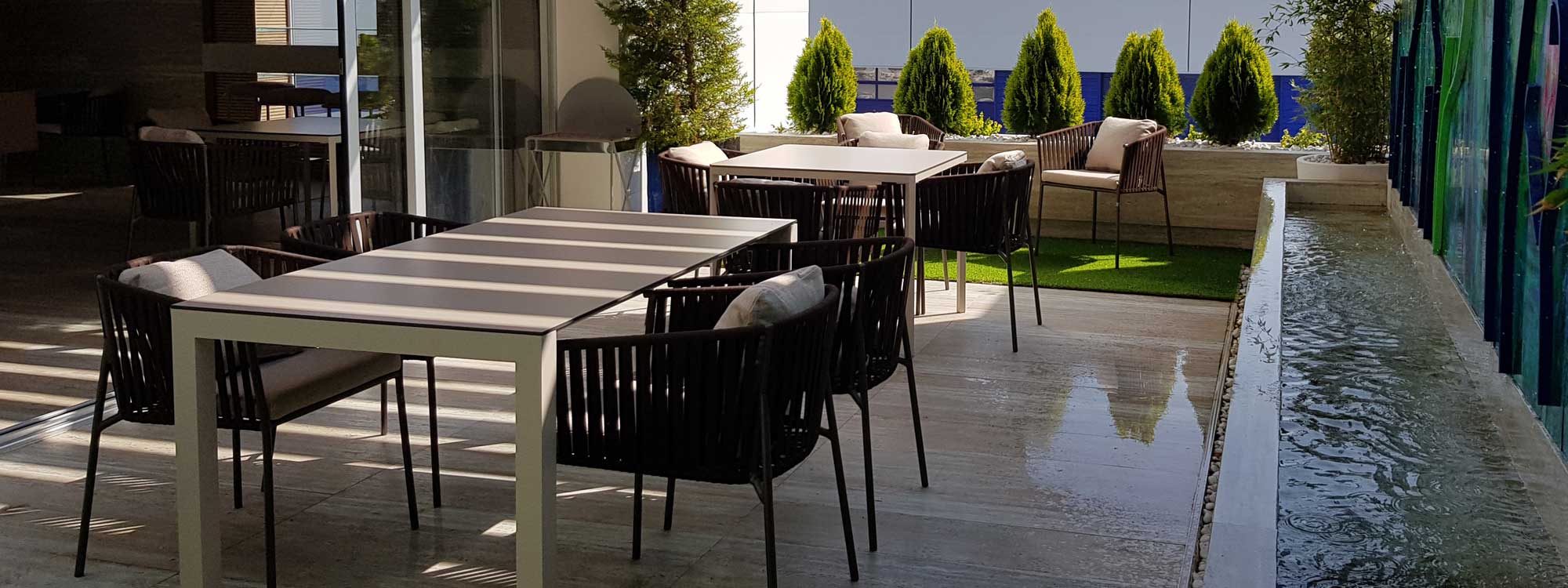 Image of Oiside Twist garden chairs and 45 extending dining table on rooftop terrace