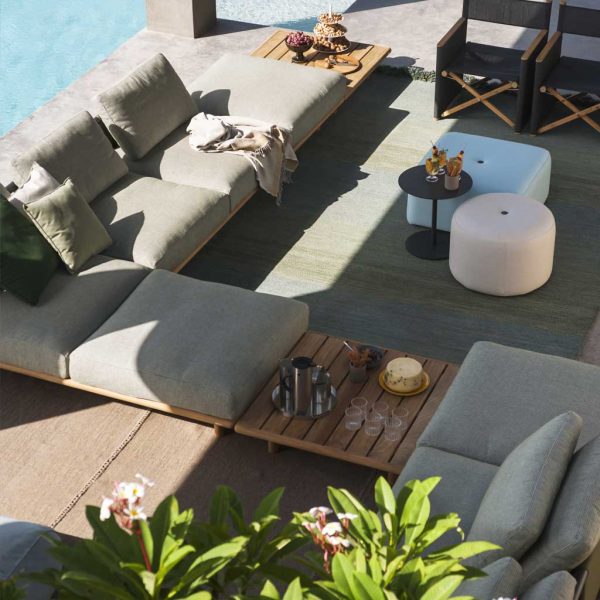 Image of aerial view of RODA Eden modular teak garden sofa, in sun and shade of poolside terrace