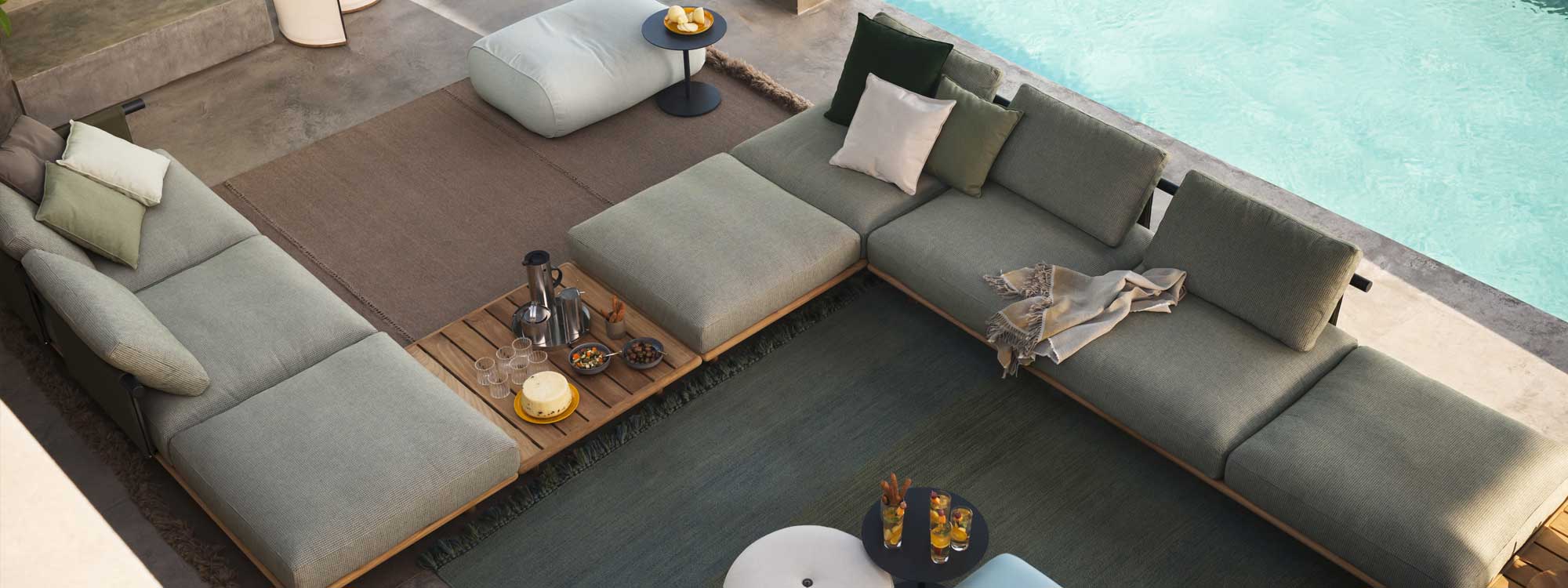 Image of S shaped Eden luxury outdoor sofa by RODA on poolside