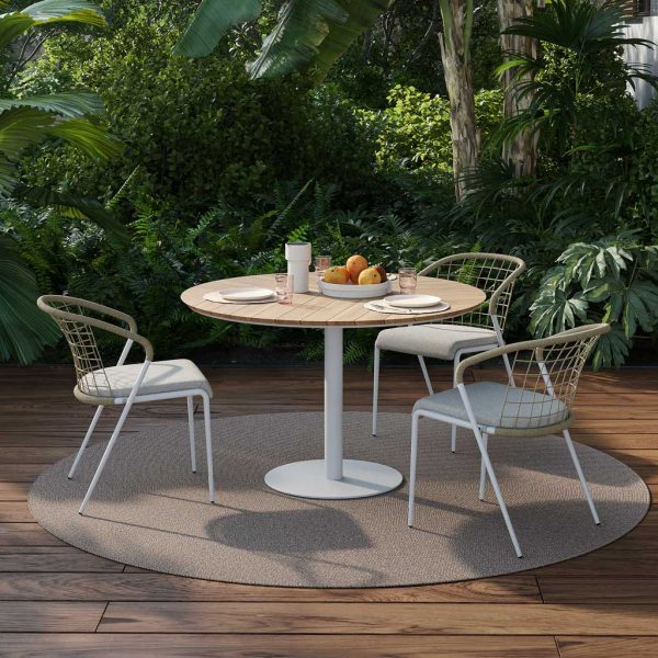 Image of Fensi modern white garden chairs and Butler circular garden dining table by Royal Botania