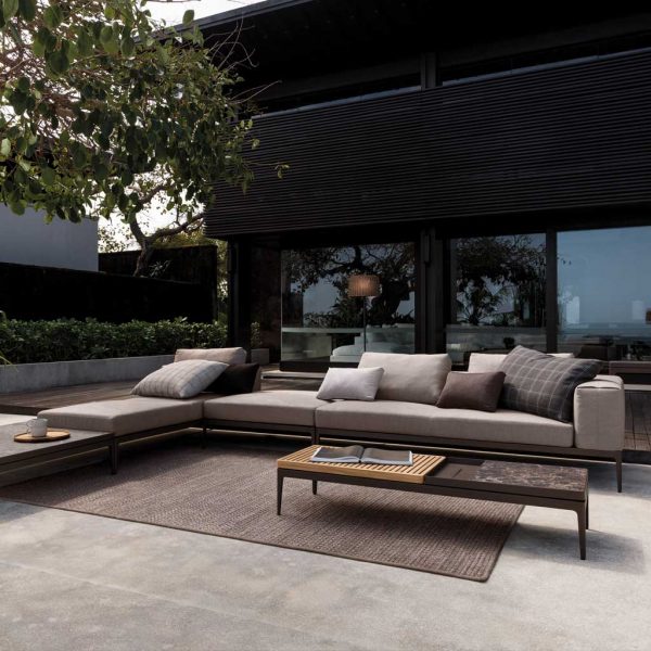 Image of Gloster Grid luxury corner sofa with minimalist architecture in the background