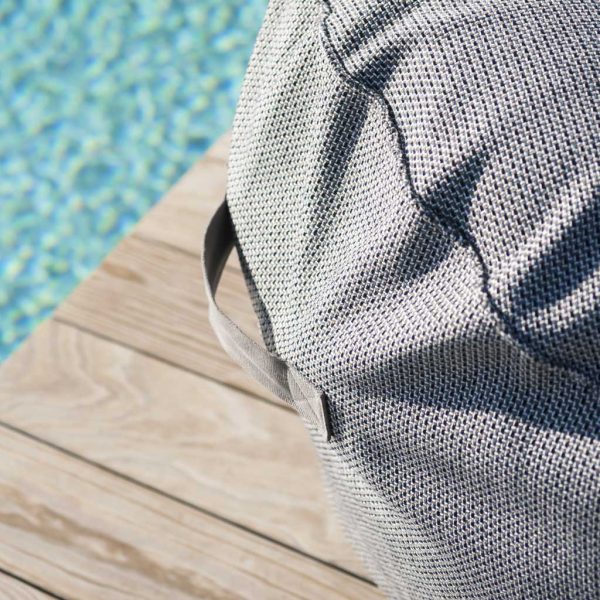 Image of detail of fabric carry handle on RODA Onda garden beanbag, shown on sunny poolside