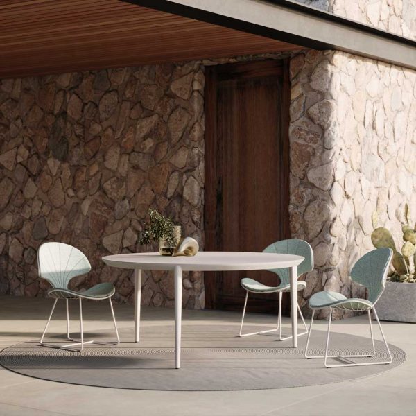 Image of Styletto contemporary ceramic table and Ostrea designer garden chairs by Royal Botania