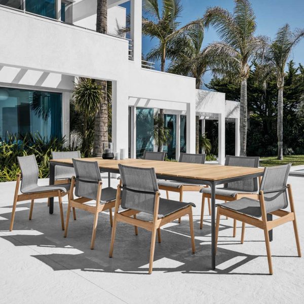 Image of Carver luxury teak garden table and Sway teak dining chairs by Gloster