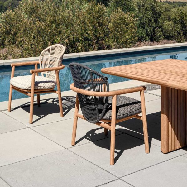 Image of Dune and Raven coloured teak garden chairs with Deck modern teak dining table by Gloster