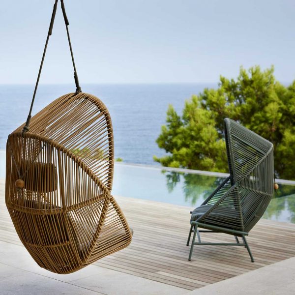 Image of Cane-line Hive hanging garden chair in natural coloured Cane-line Weave and Hive lounge chair with base in Dusty Green Cane-line Weave