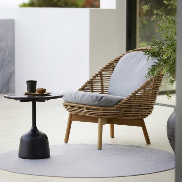 Image of Glaze modern cane garden chair and Glaze side table by Cane-line