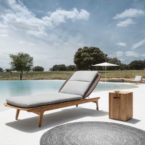 Image of Gloster Kay contemporary teak sun lounger & Block side table on poolside
