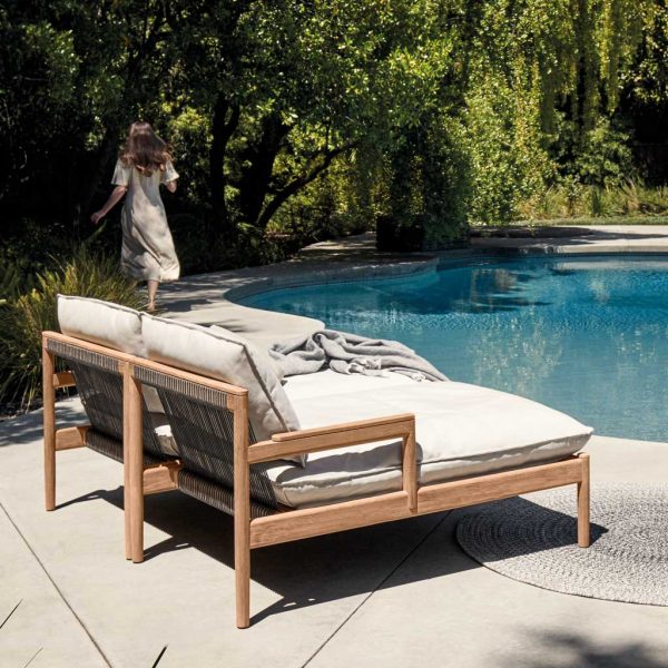 Image of pair of Saranac teak daybeds with Raven-coloured synthetic rope backs by Gloster