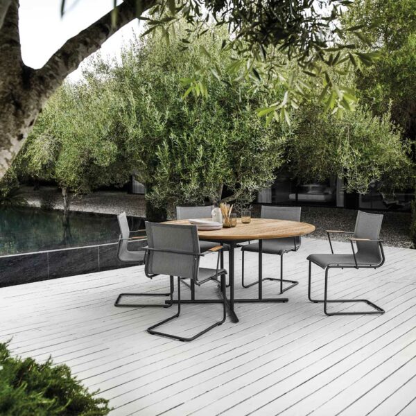 Image of Sway comfy garden chairs around a circular Gloster garden table