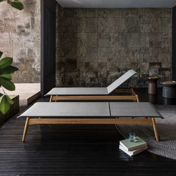 Image of Sway contemporary teak sunbeds with Batyline mesh fabric seat and back by Gloster