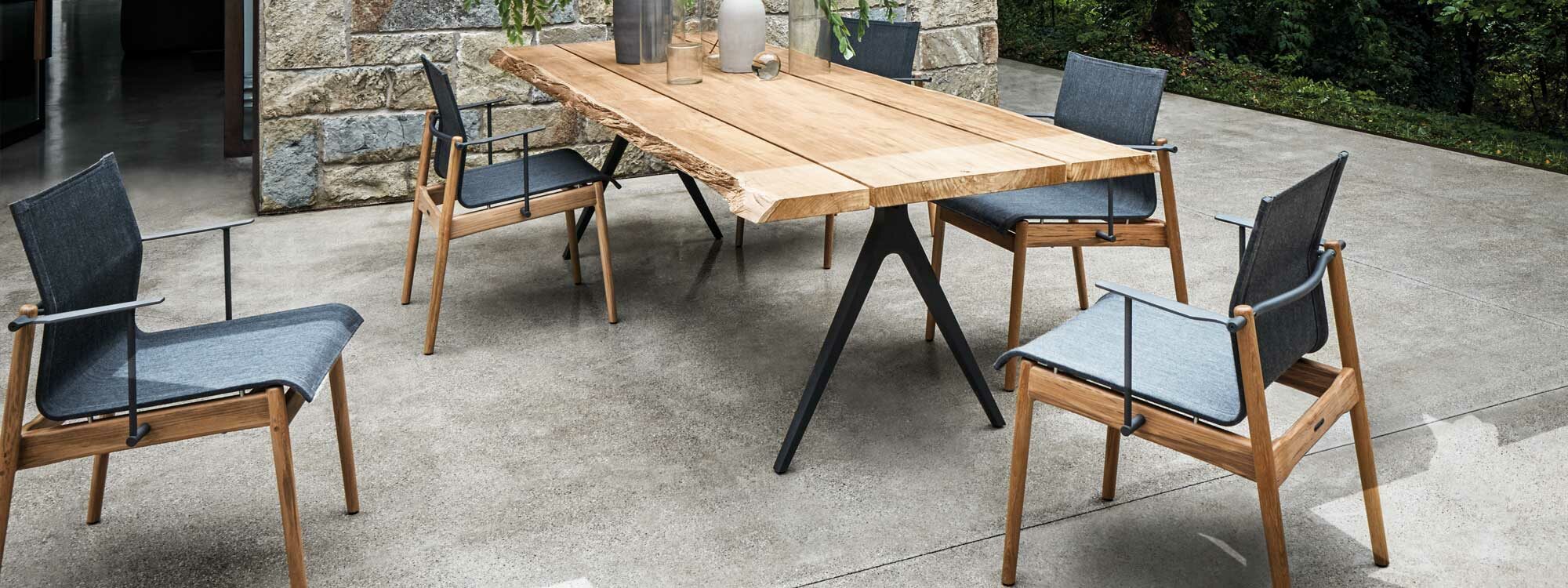 Image of Sway stacking teak garden chairs and Raw teak planked garden table by Gloster
