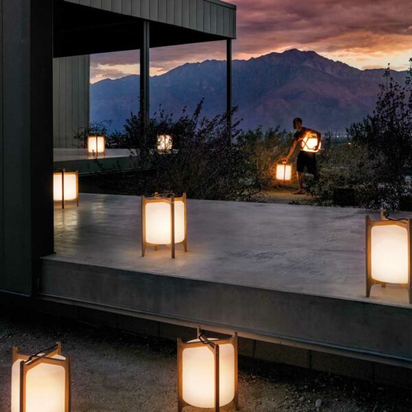 Image of Gloster Ambient Lanterns on terrace at dusk with mountainside in the background