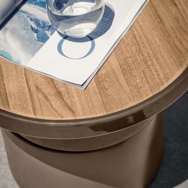 Image of detail of Gloster Coso's teak table top and Sand coloured glazed & unglazed ceramic base