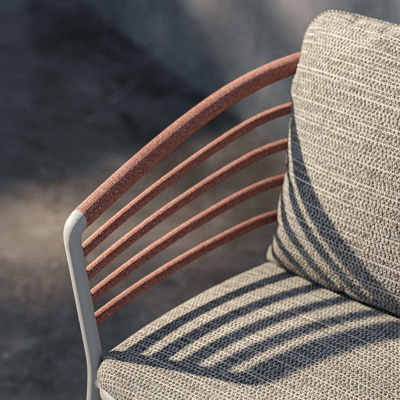 Image of Archy outdoor dining chair's horizontal armrest bars casting shadows onto the seat & back cushions